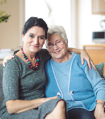 woman sitting with her senior mother