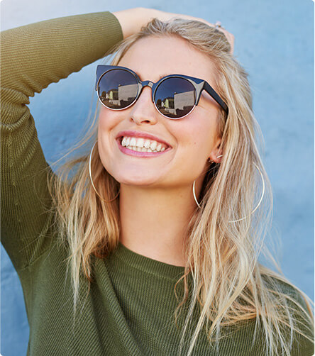 smiling woman wearing sunglasses