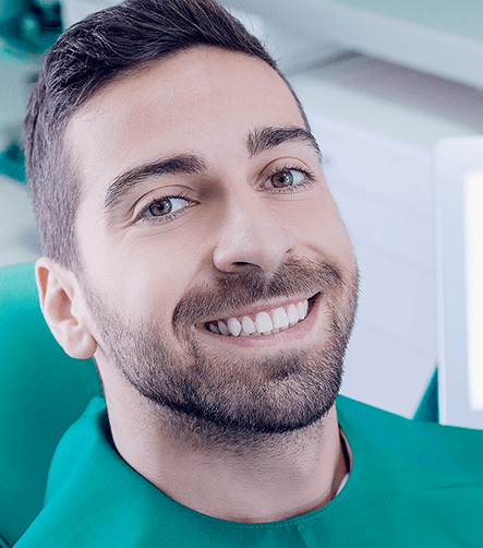 smiling man in dental chair